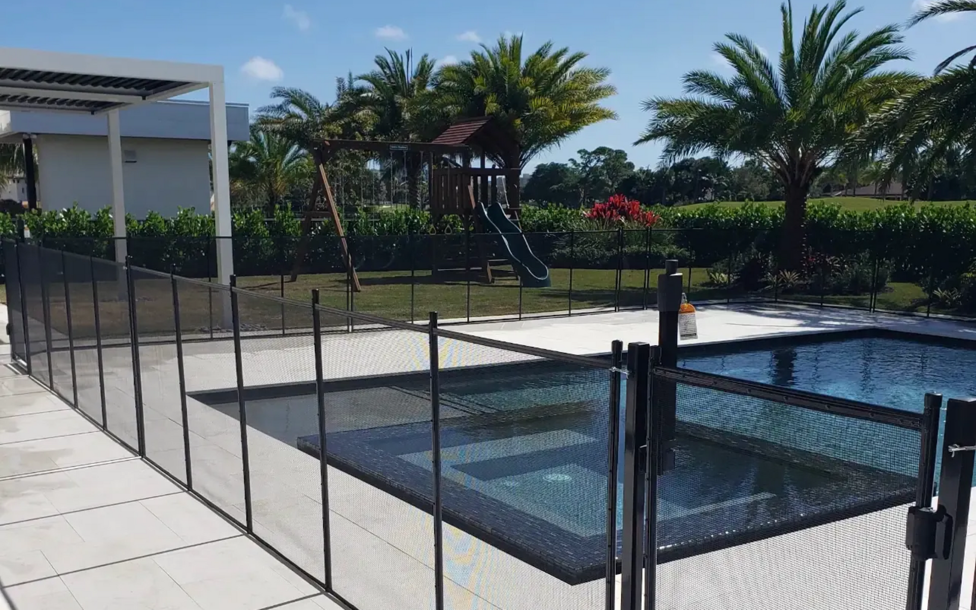 Safety fencing installed around a residential pool