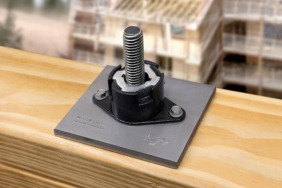 A Screw Is Drilled With Metal Plate On A Wooden Surface — All Trades Equipment In Lismore, NSW
