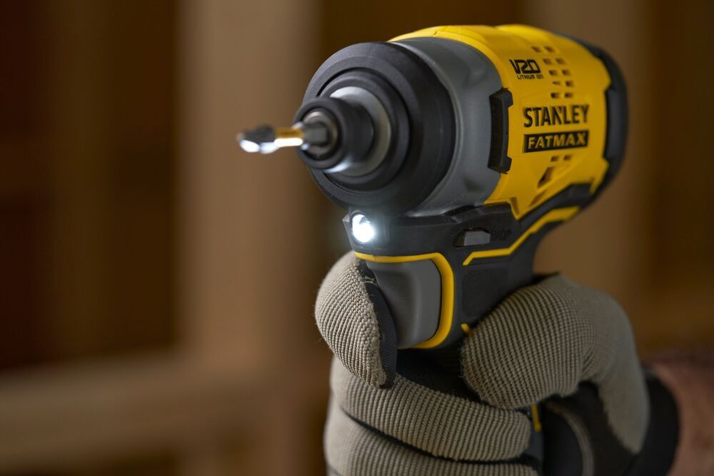 A Person Is Holding A Stanley Fatmax Cordless Impact Driver — All Trades Equipment In Lismore, NSW