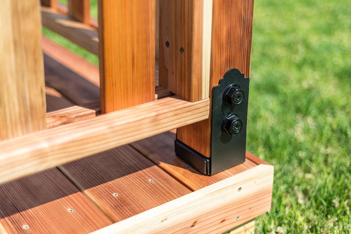 A Close Up Of A Wooden Deck With A Metal Bracket — All Trades Equipment In Lismore, NSW