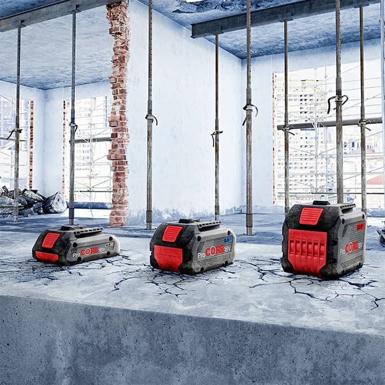 Three Batteries Are Sitting On A Concrete Surface In A Room — All Trades Equipment In Lismore, NSW