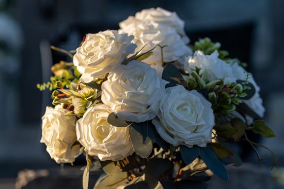 White rose bouquet with greenery in soft natural light