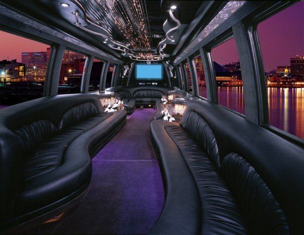 The inside of a limousine with purple carpet