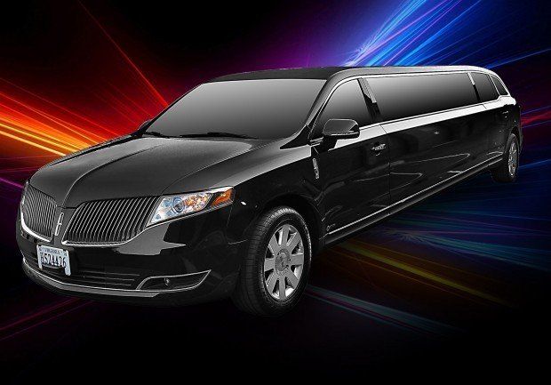 A black limousine is parked in front of a colorful background.