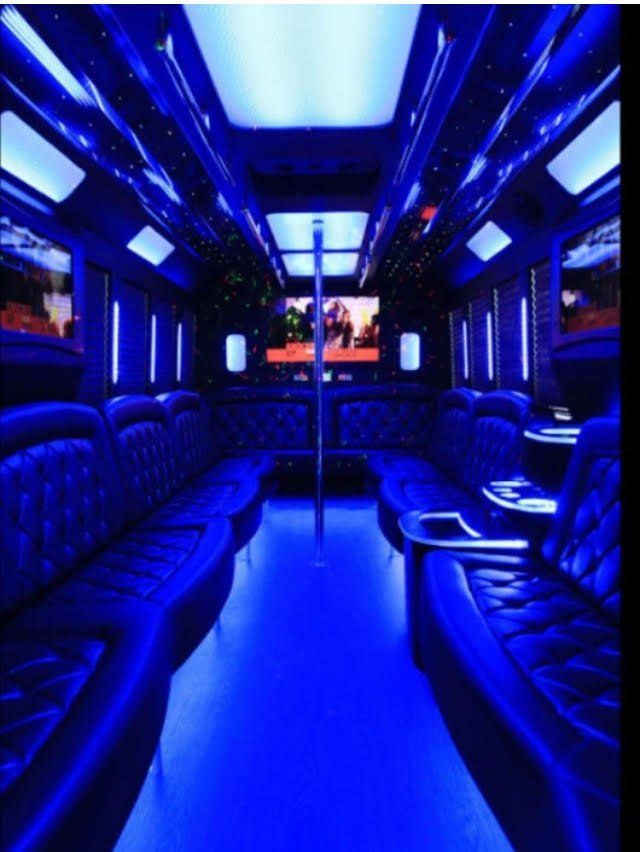 The inside of a bus with blue lights on it