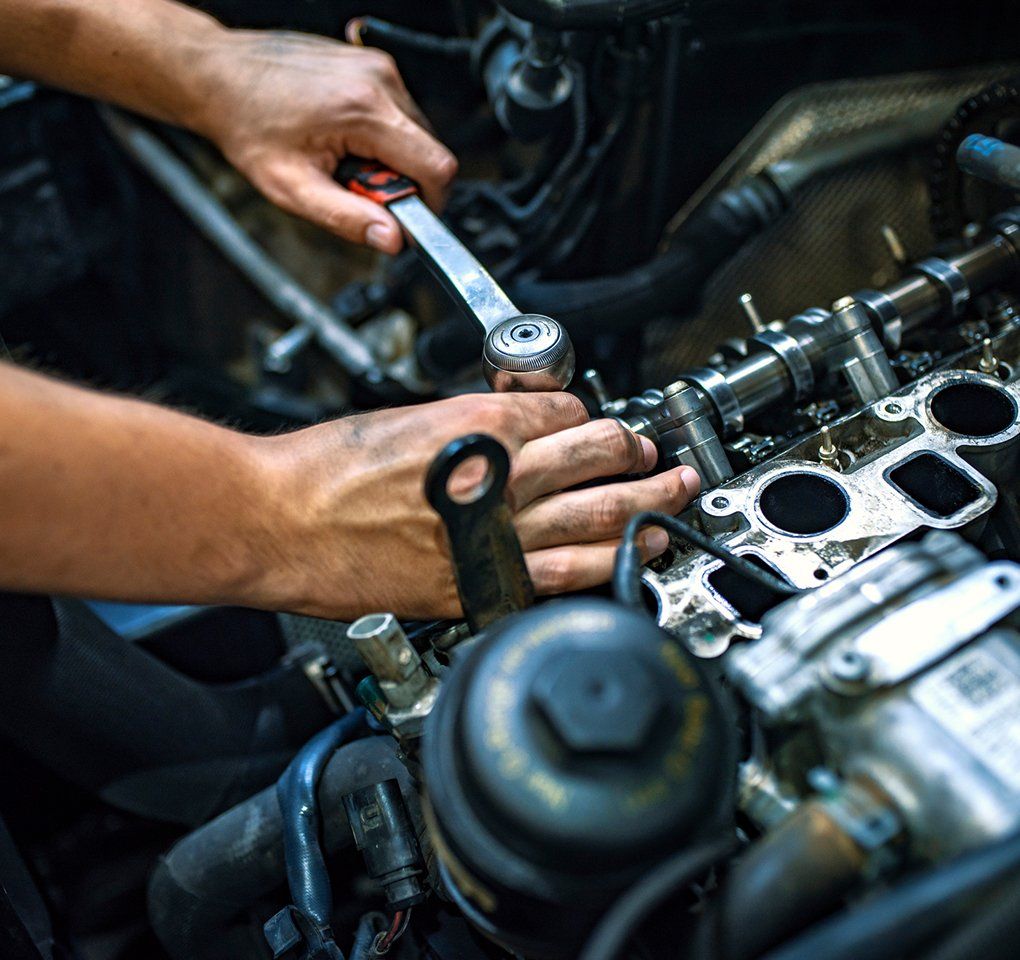 Mechanic Repairing The Car Engine — Hagerstown, MD — Guaranteed Truck & Auto Repair Mechanic Repairing The Car Engine — Hagerstown, MD — Guaranteed Truck & Auto Repair