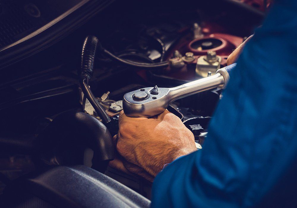 Man Doing Engine Repair — Hagerstown, MD — Guaranteed Truck & Auto Repair