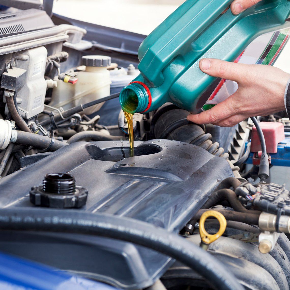 Person Filling In New Engine Oil — Hagerstown, MD — Guaranteed Truck & Auto Repair