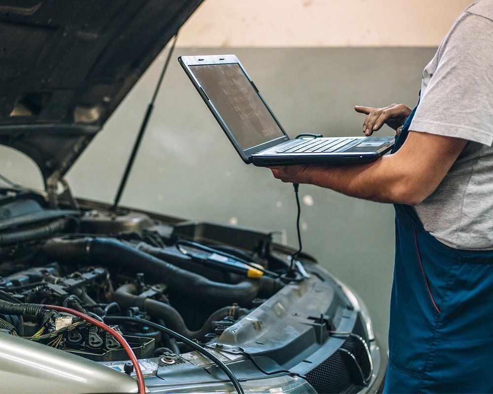 Person Checking Car Condition — Hagerstown, MD — Guaranteed Truck & Auto Repair