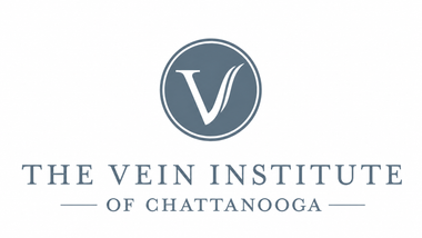 Logo for The Vein Institute of Chattanooga with a blue circular “V” emblem and serif text
