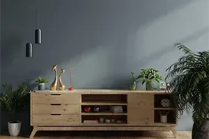 There is a wooden dresser in the middle of the room.