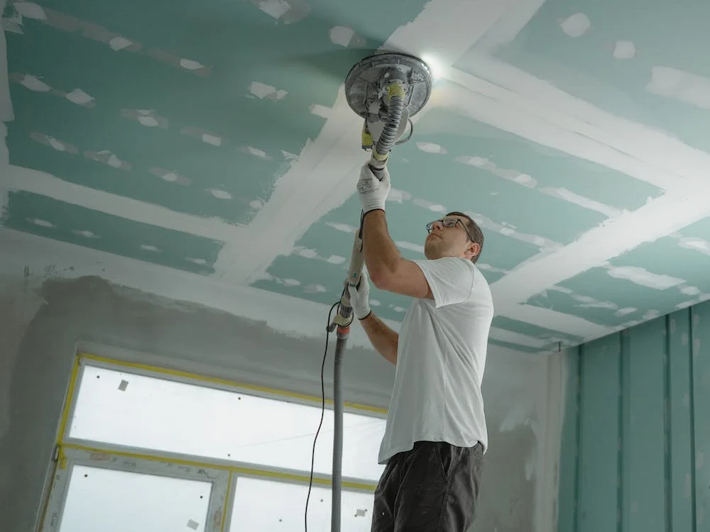 man painting ceiling long island