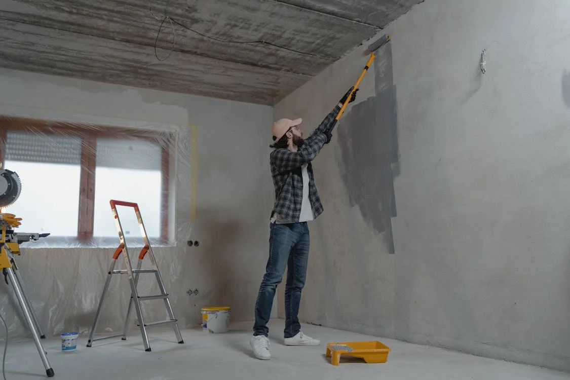 man paints wall long island ny