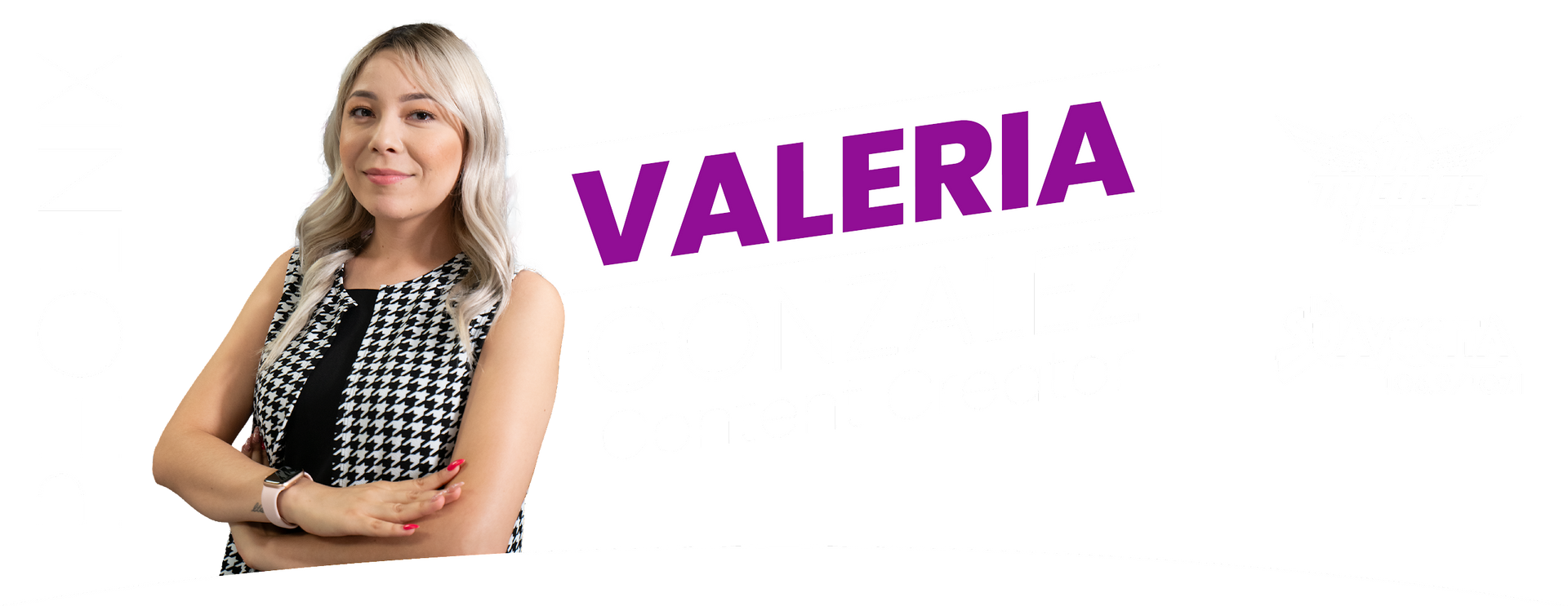 A woman is standing with her arms crossed in front of a sign that says valeria.