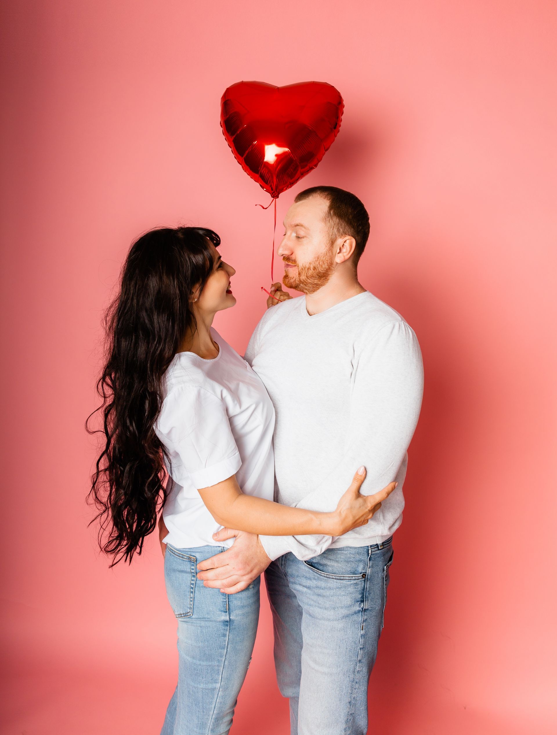Mand and woman on a pink valentine theme background