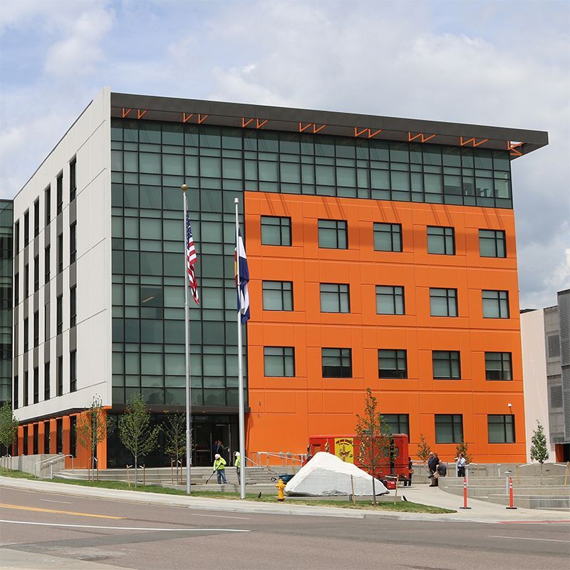 A large orange building with a lot of windows