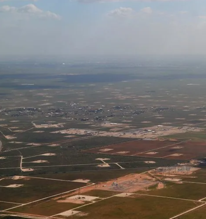 An aerial view of a landscape with lots of fields
