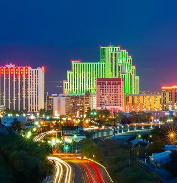 A city at night with a lot of lights on the buildings