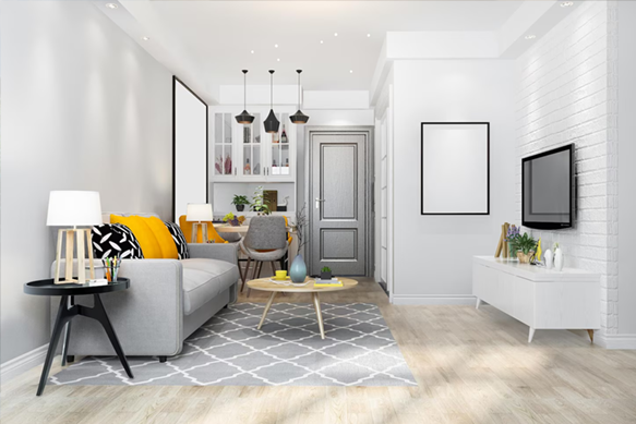 Modern open-plan living room with gray sofa, yellow pillows, kitchen island, and light wood flooring