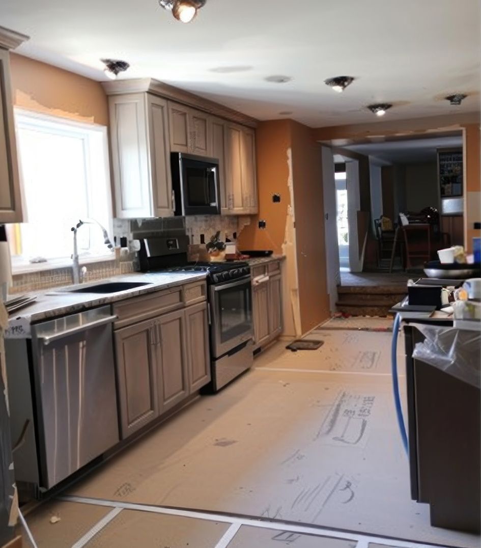 A kitchen with stainless steel appliances and white cabinets