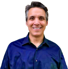 Smiling man in a dark blue button-up shirt against a white background