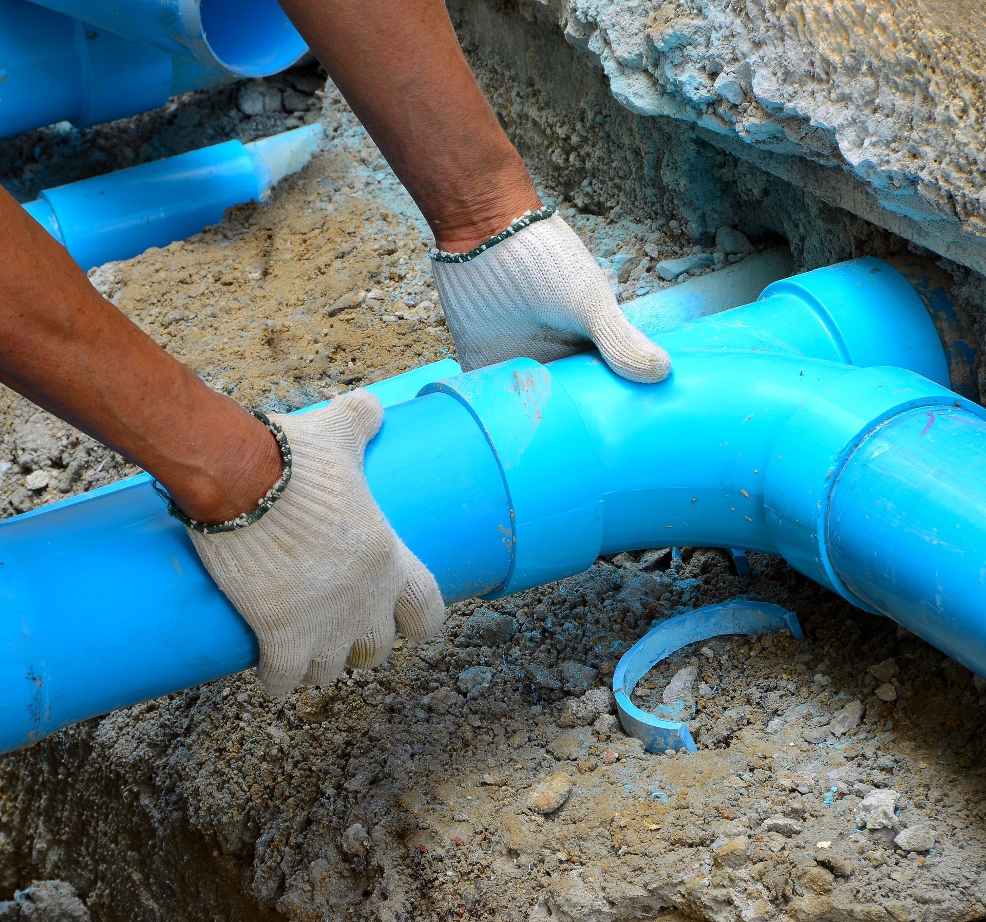 a plumber is repairing a water pipe