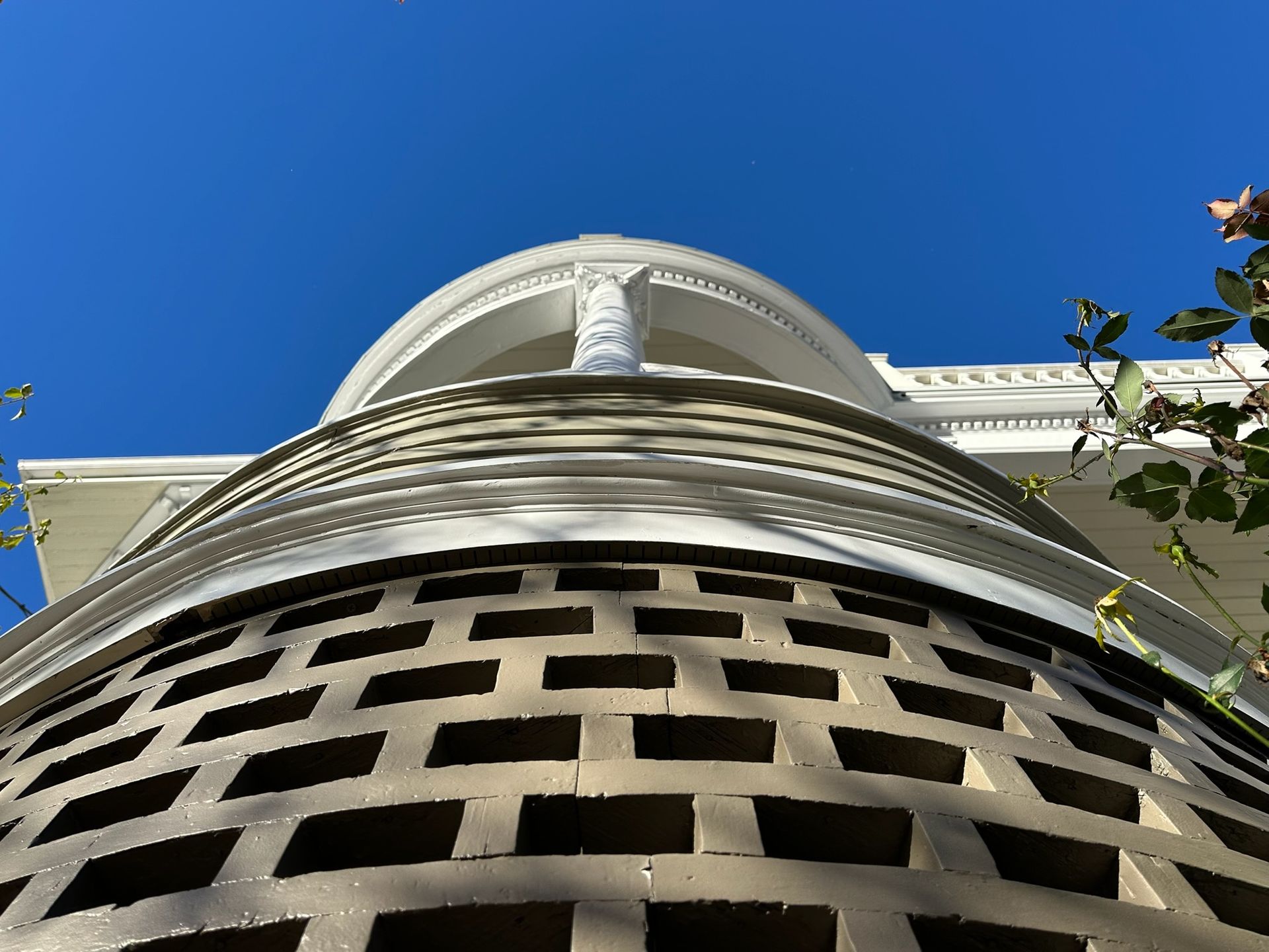 An upwards shot of a white pillar
