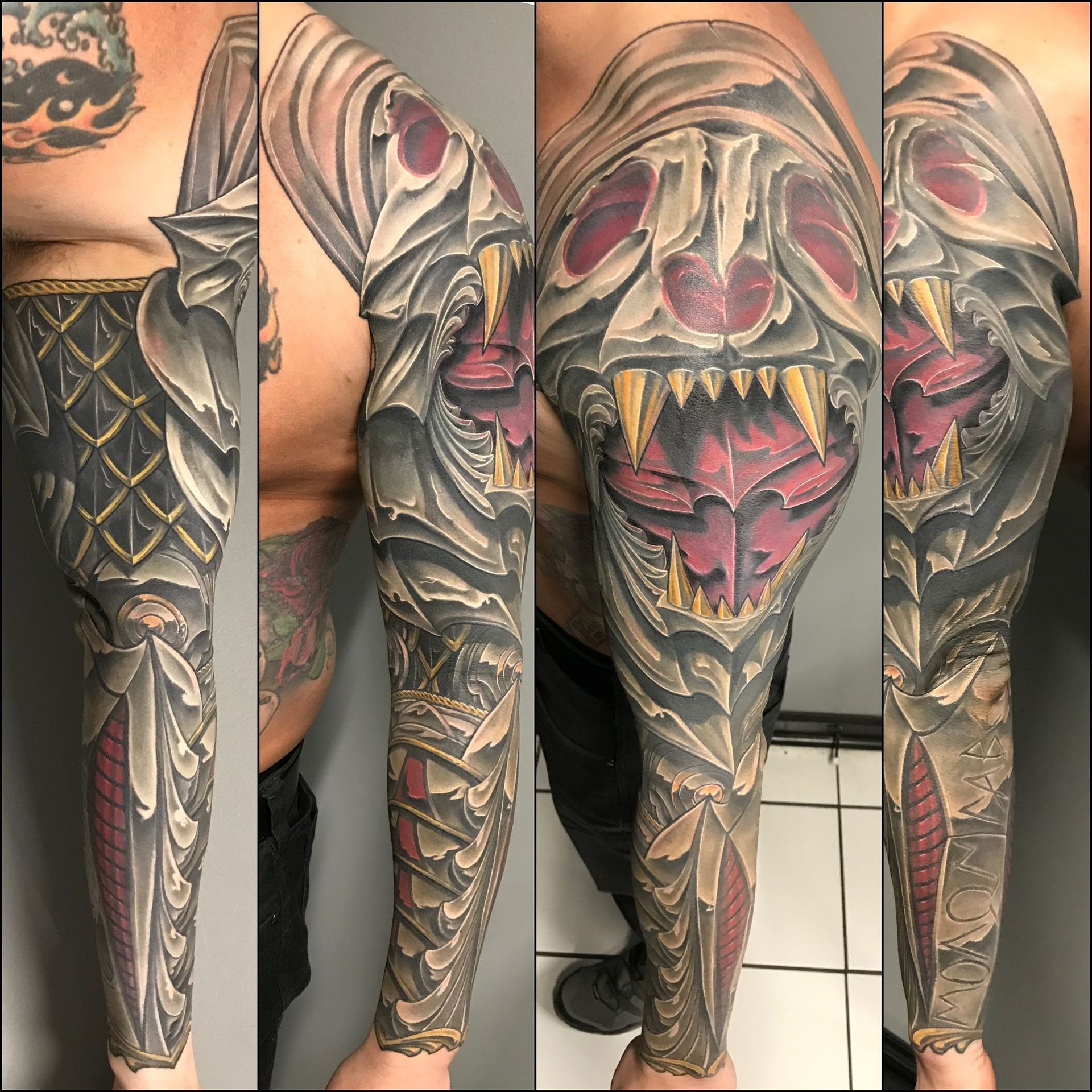 A man has a full sleeve tattoo on his arm