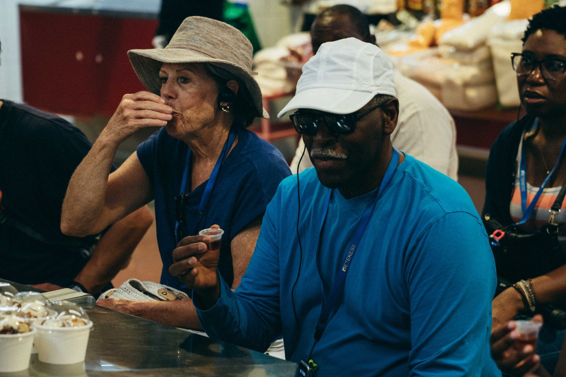 Guests tasting local flavors at the market