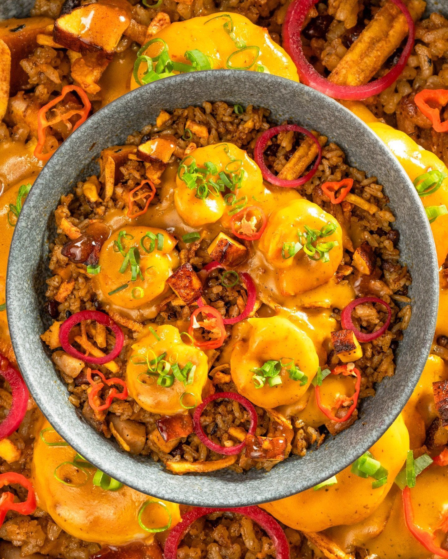 Seafood rice with yellow sauce and pickled peppers at La Tapa del Coco