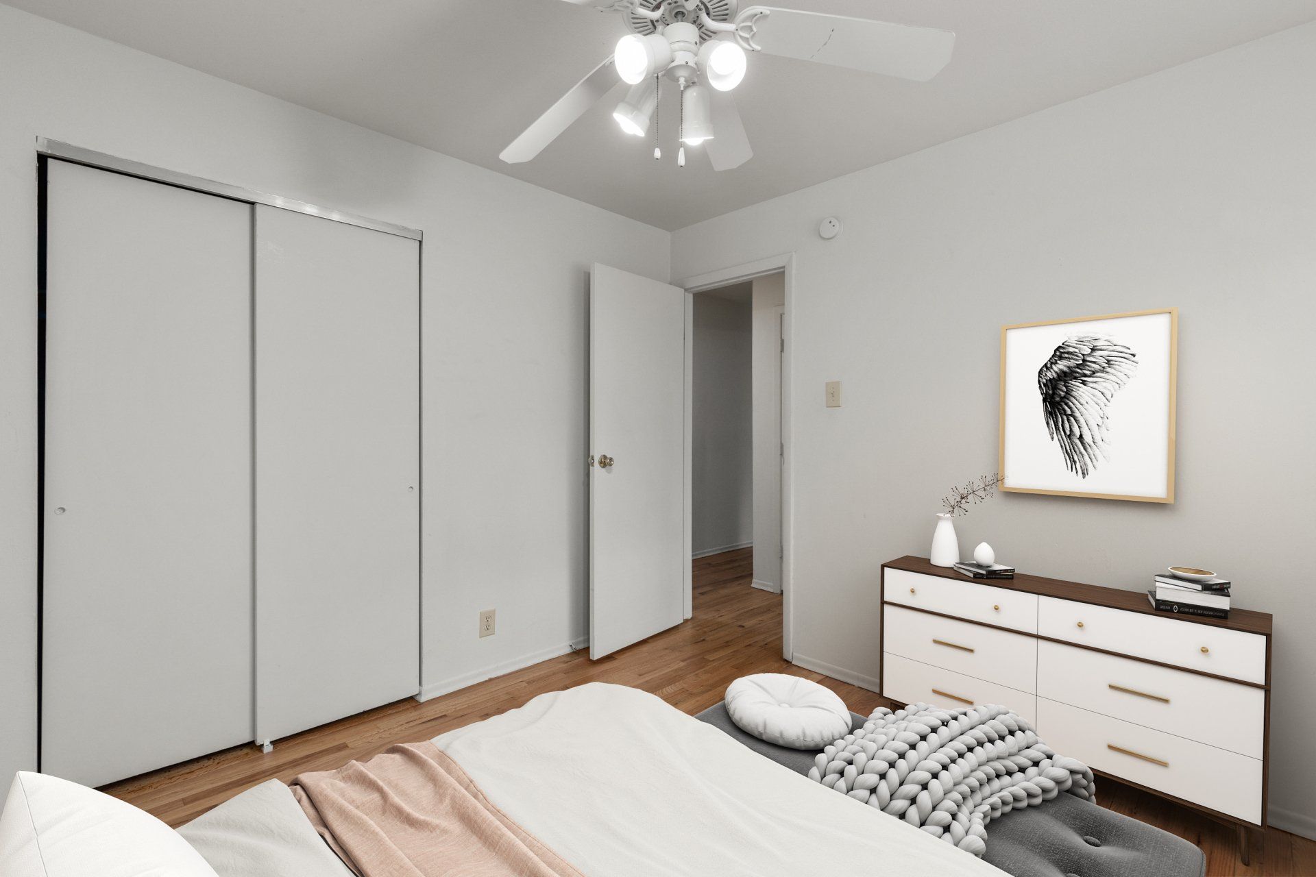 Leslie Apartments bedroom with ceiling fan