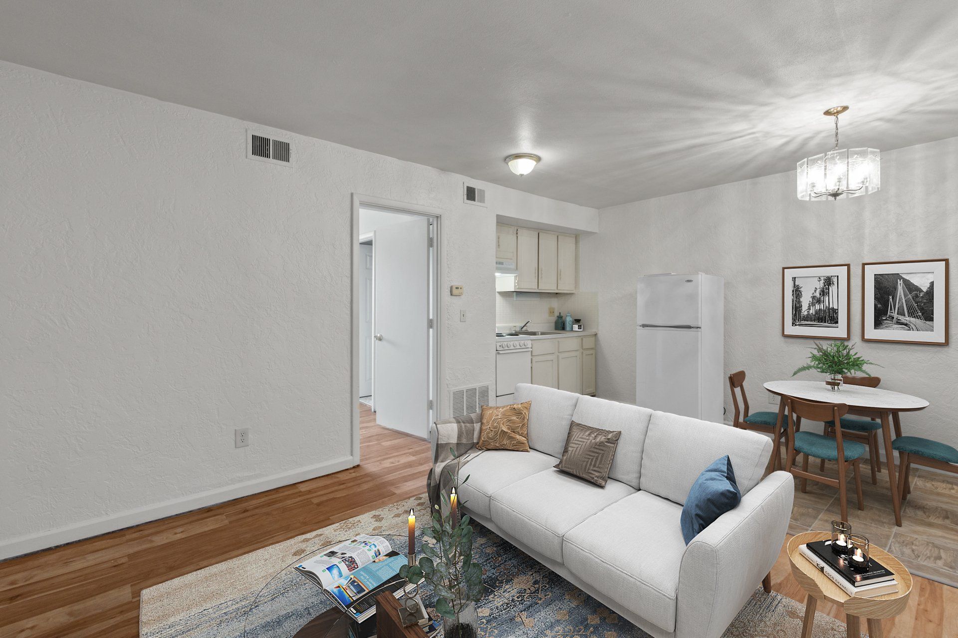 Updated living room with hardwood floor; sofa is for example only.