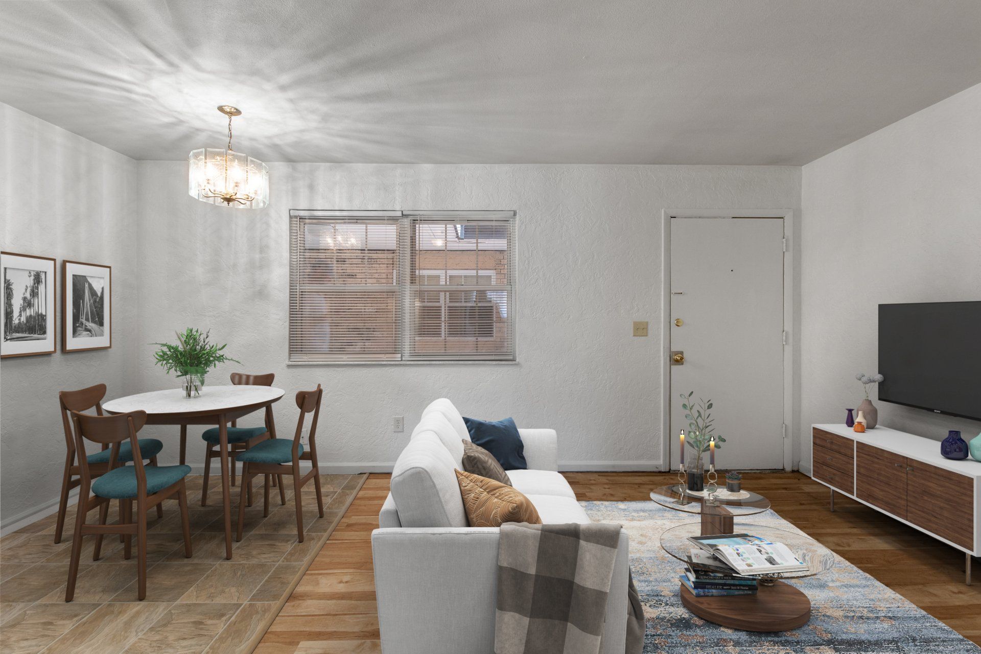 Updated living room with hardwood floor ; sofa and dining table are for example only.