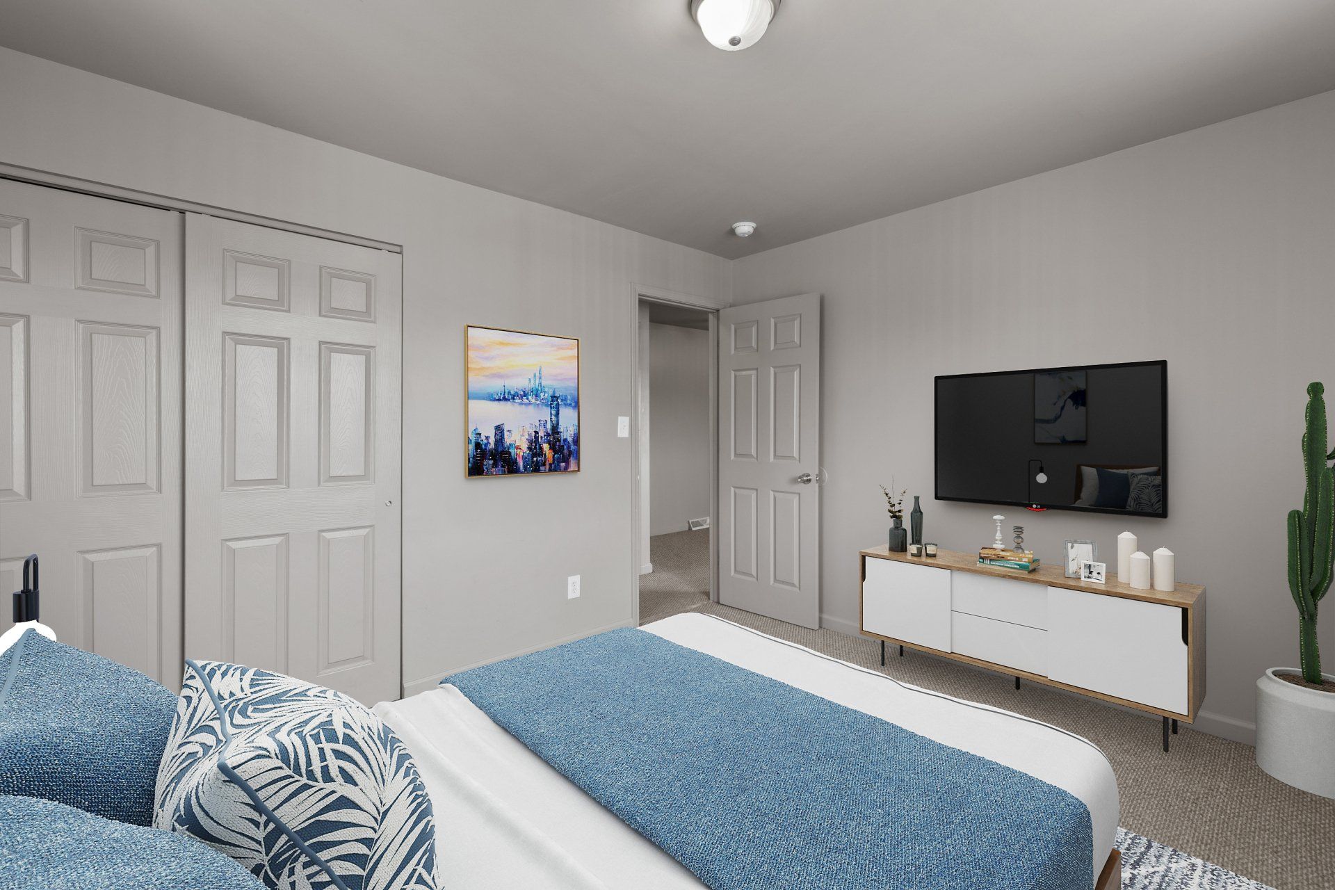 Teson Garden Apartments bedroom with two windows and bed and rug - furniture for example purposes only.