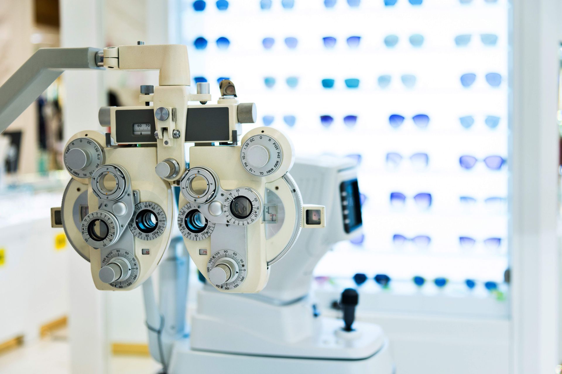 Phoropter and Eyeglasses in Eye Store — West Plains, MO — Vision Xpress Phoropter and Eyeglasses in Eye Store — West Plains, MO — Vision Xpress
