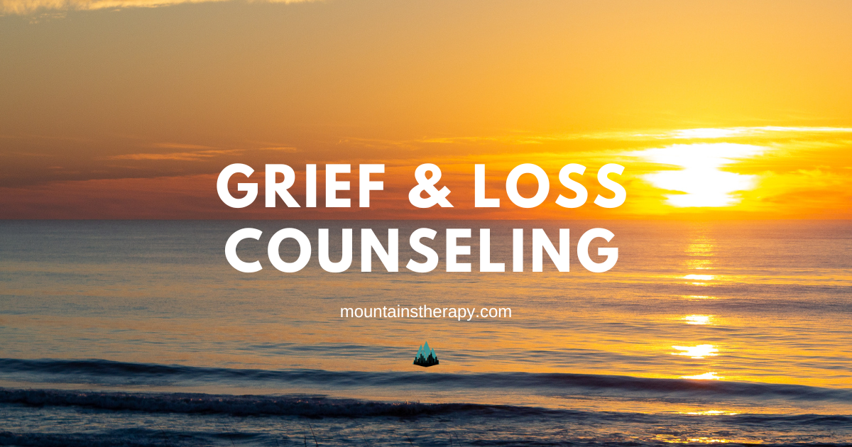 Grief & loss counseling text over ocean sunset.