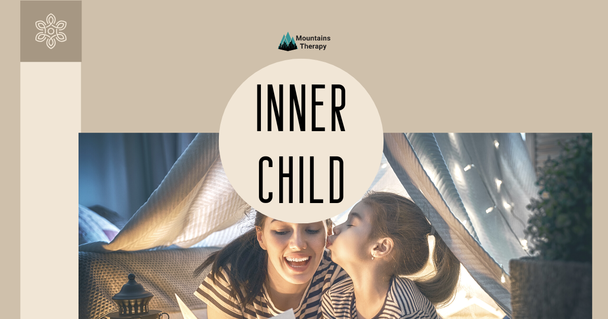 Mother and child under a blanket tent, laughing.
