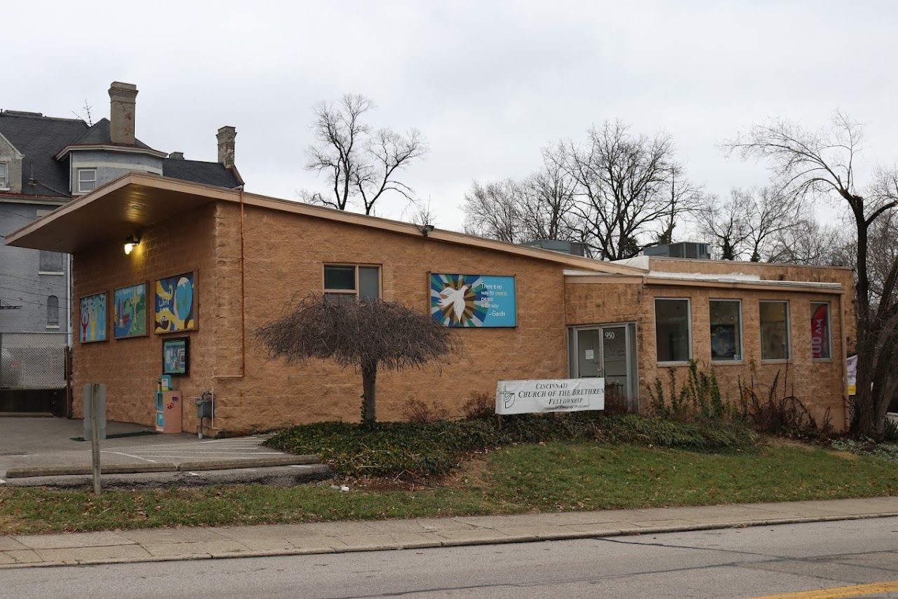 A brick building with a tree in front of it A brick building with a tree in front of it