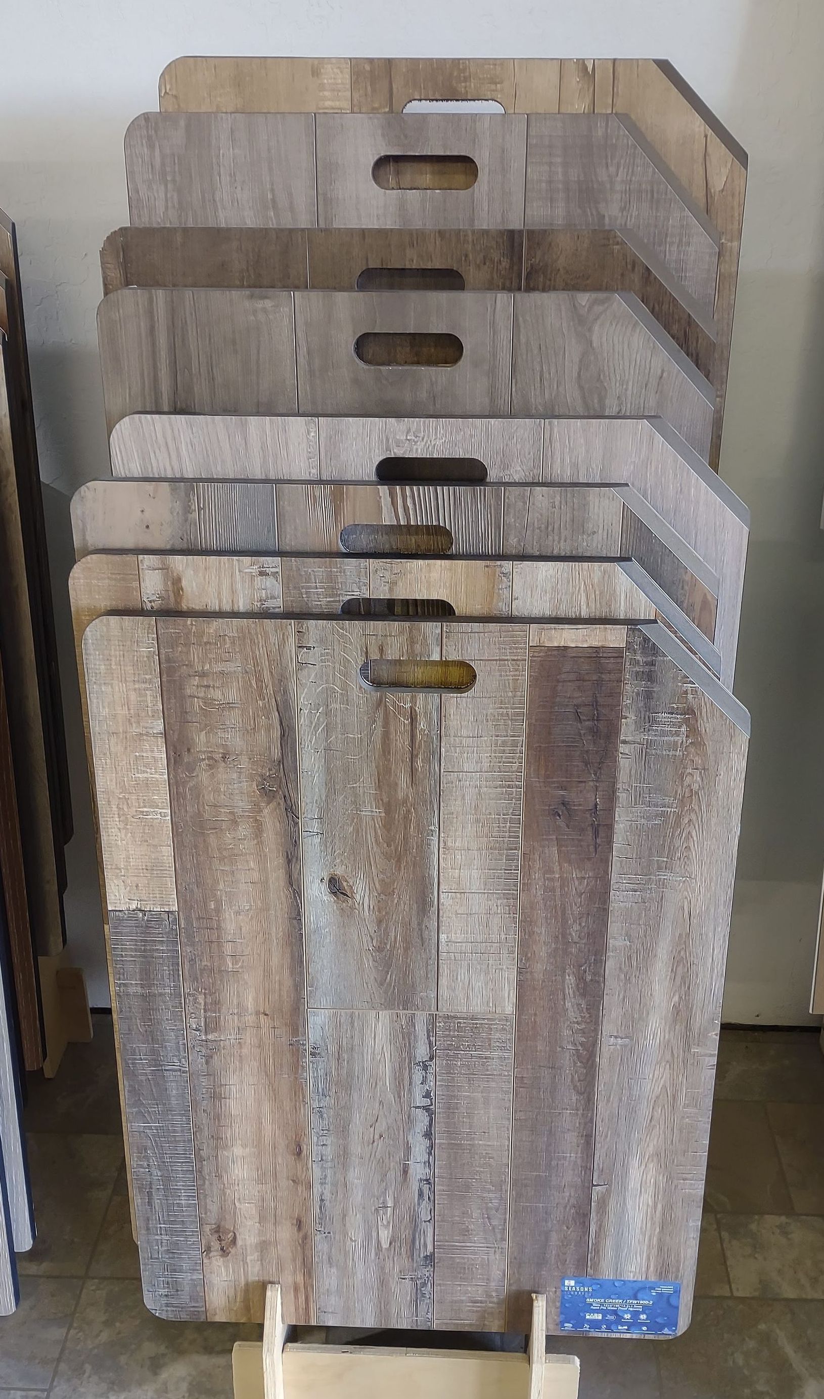 A stack of wooden boards with holes in them