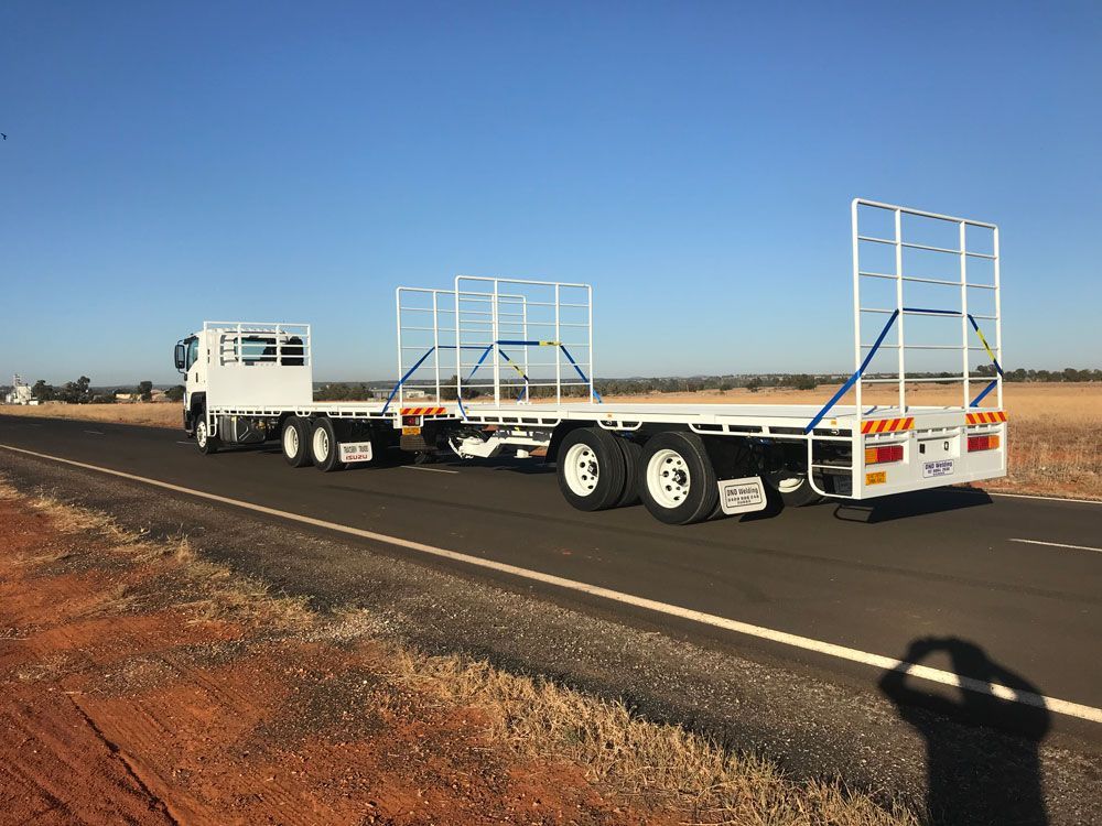 White Truck with Extended Trailer — Welders in Dubbo