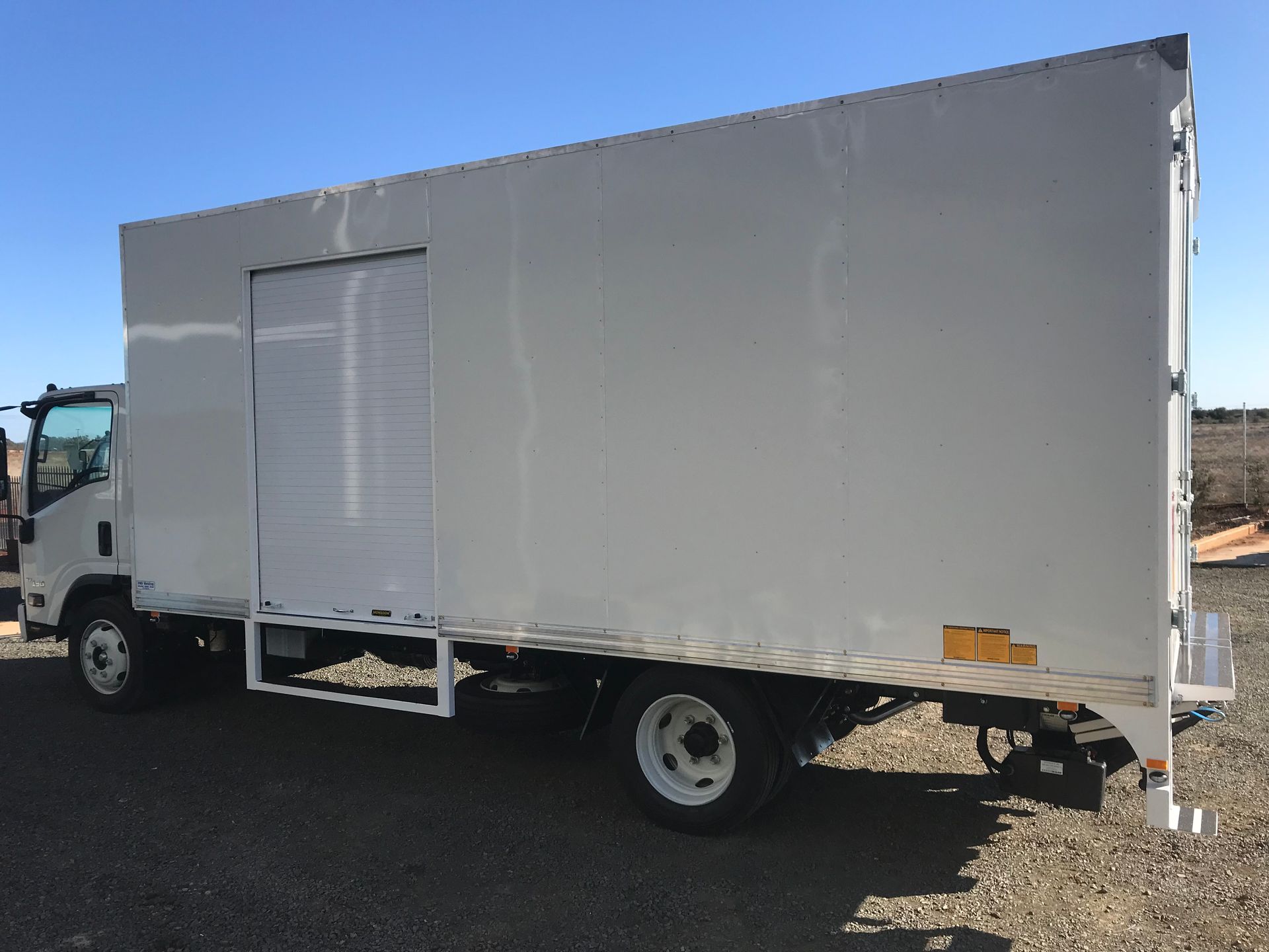 Big White Truck with Roller door — Welders in Dubbo