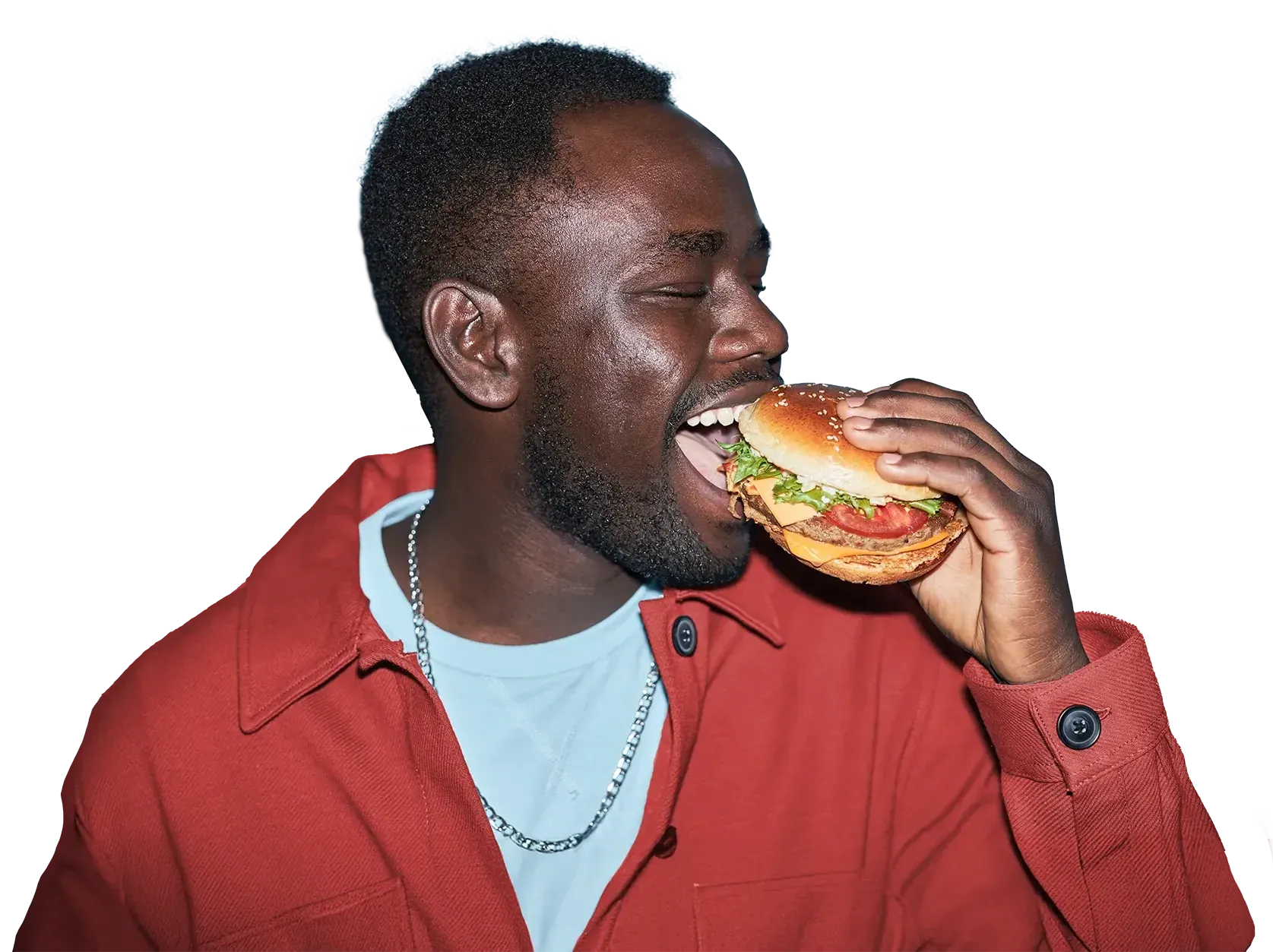 Un homme en veste rouge croque dans un hamburger Burger Choice Uccle