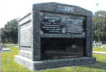 A grave in a cemetery with the name curry on it