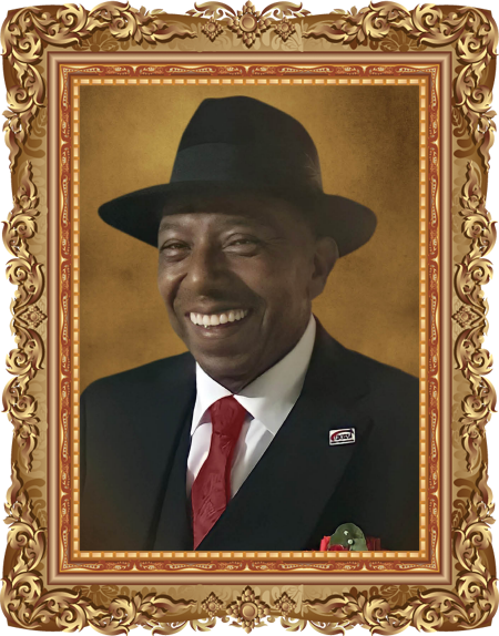 A man in a suit and hat is smiling in a picture frame