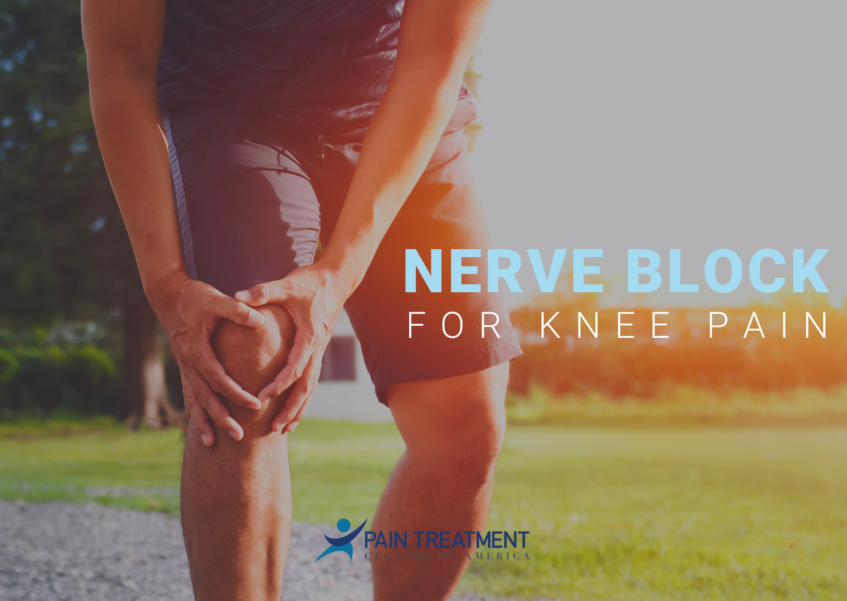 A person is holding their knee in pain.