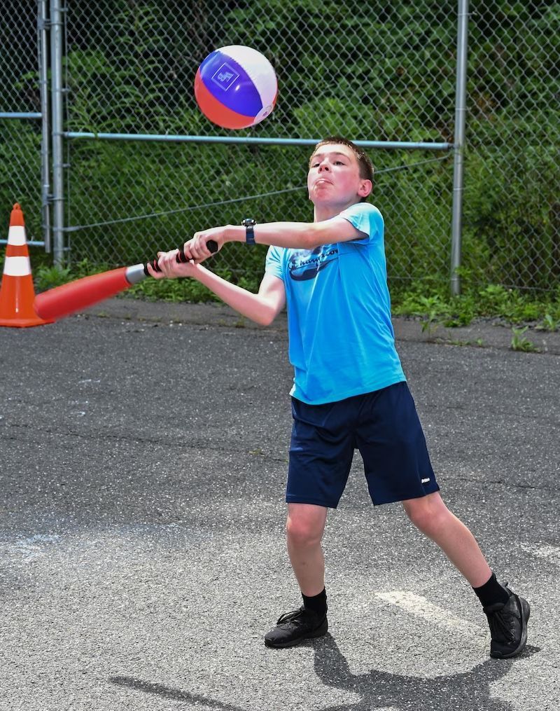 BHN kamp for kids opening day celebration - kid playing ball
