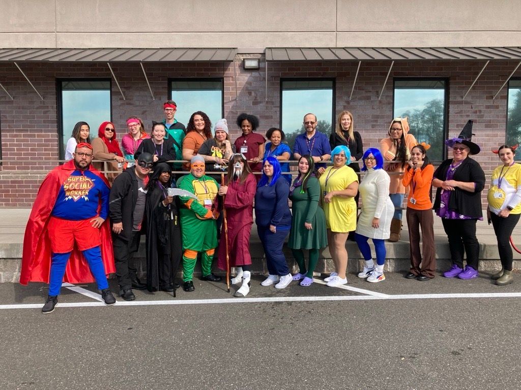 Superhero day at BHN - staff dressed up and posing together