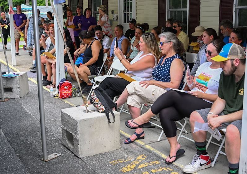 BHN kamp for kids opening day celebration - parents and community memebers watching kampers perfomr
