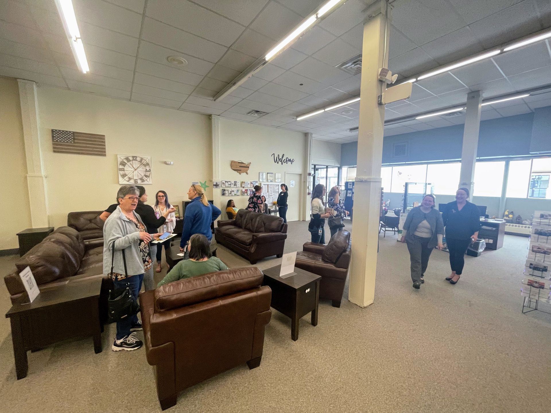 Ware Family Resource Center grand opening celebration - people milling arond the center.