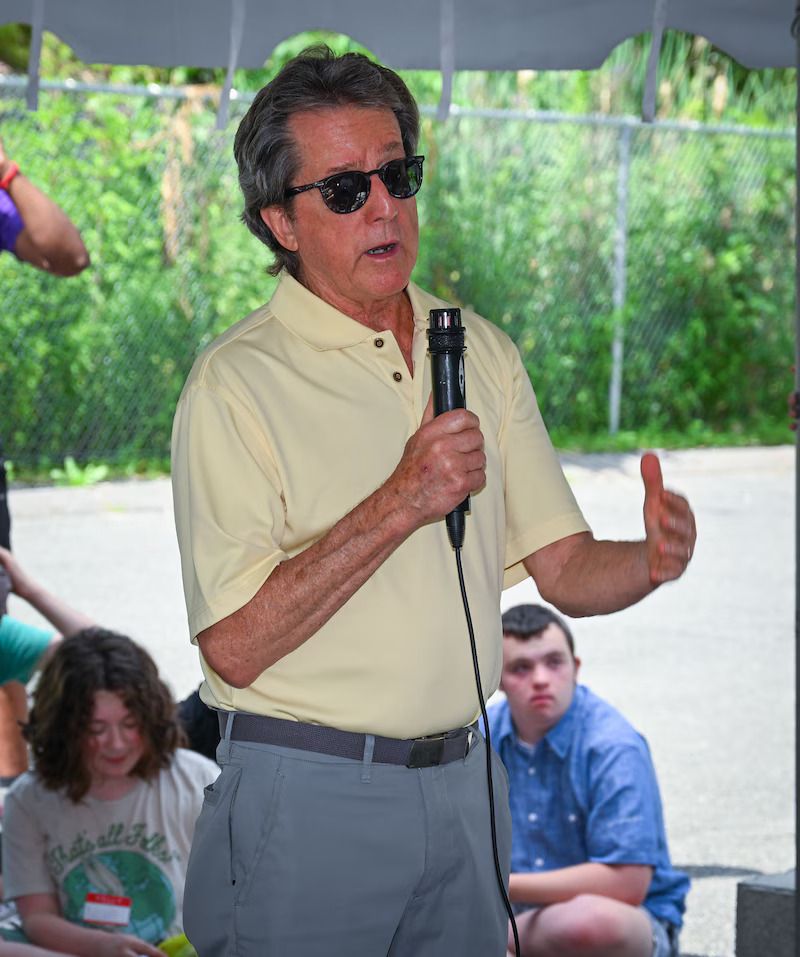 BHN kamp for kids opening day celebration - a man speaking at the event
